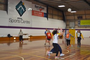 girls playing indoor netball